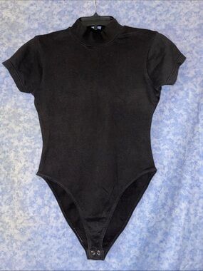 Betty Blue: Black Short-Sleeve One-Piece Bodysuit